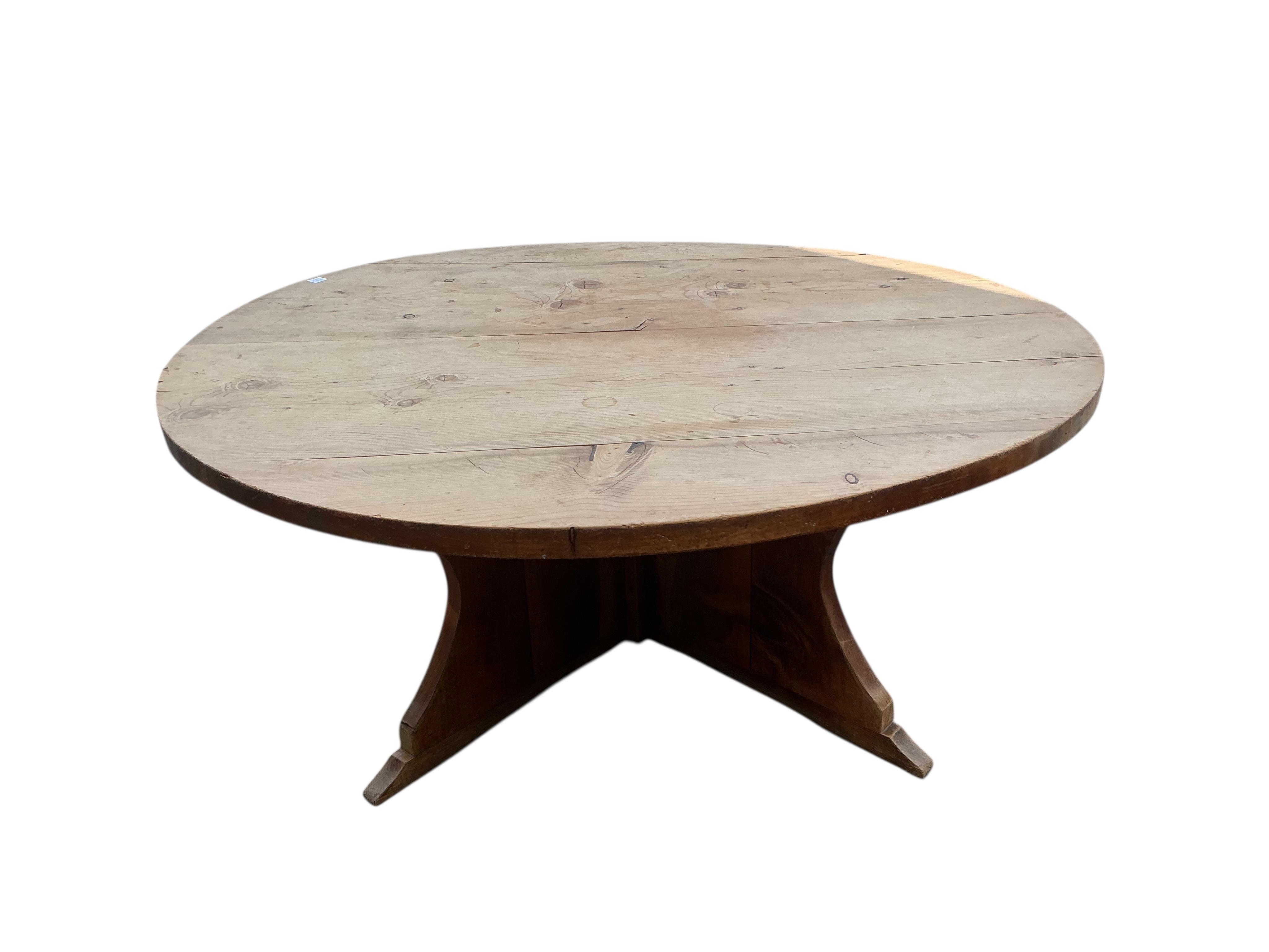 A large circular pine breakfast table, diameter 181cm, height 72cm